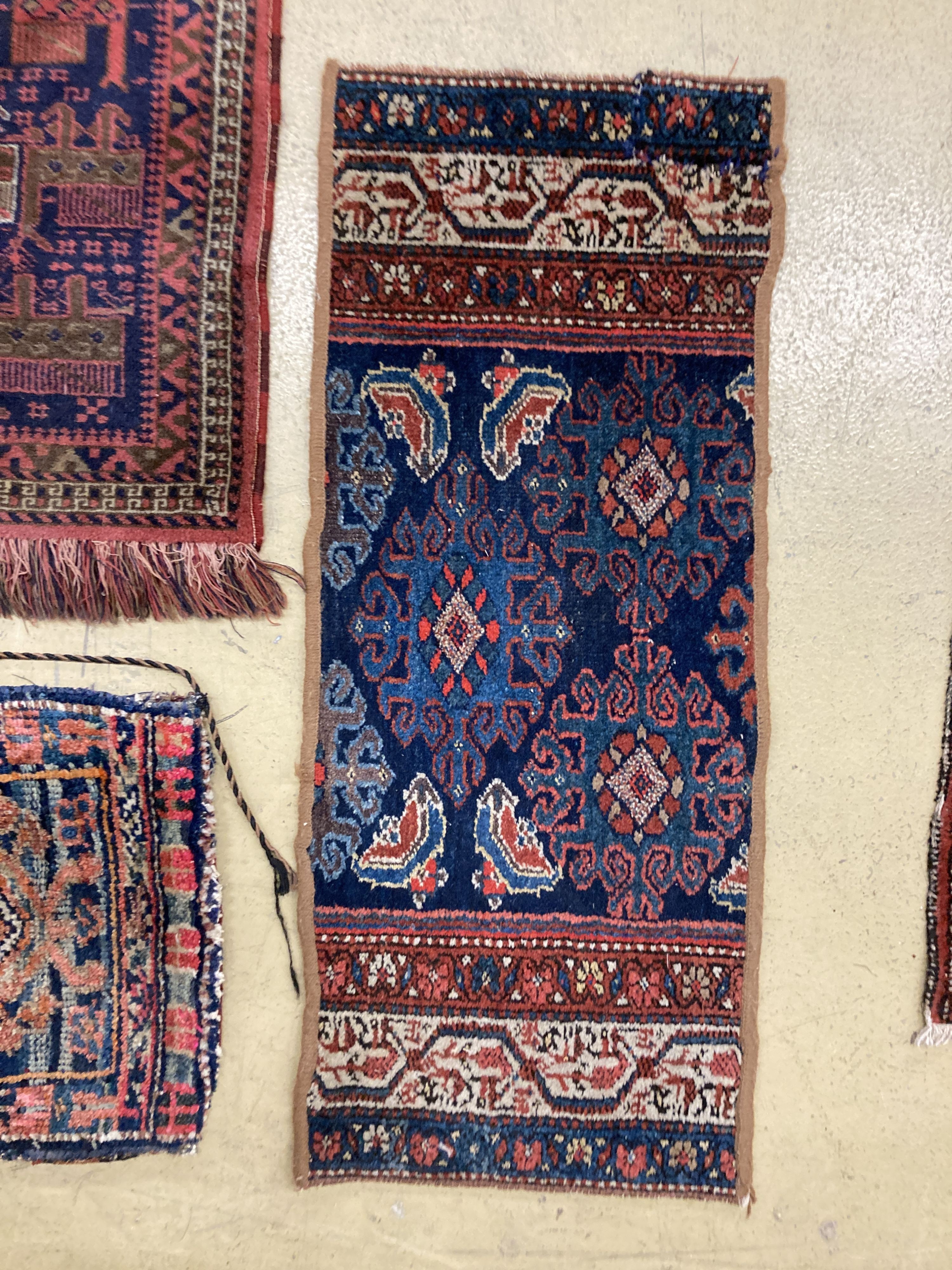 A Caucasian saddle bag and three mats, largest 100 x 40cm